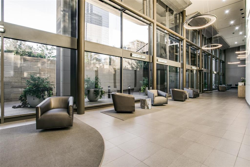 1200 Main Street, Unit 1908 Dallas, TX 75202 - Photo 18 of 27 a living room with furniture and a floor to ceiling window