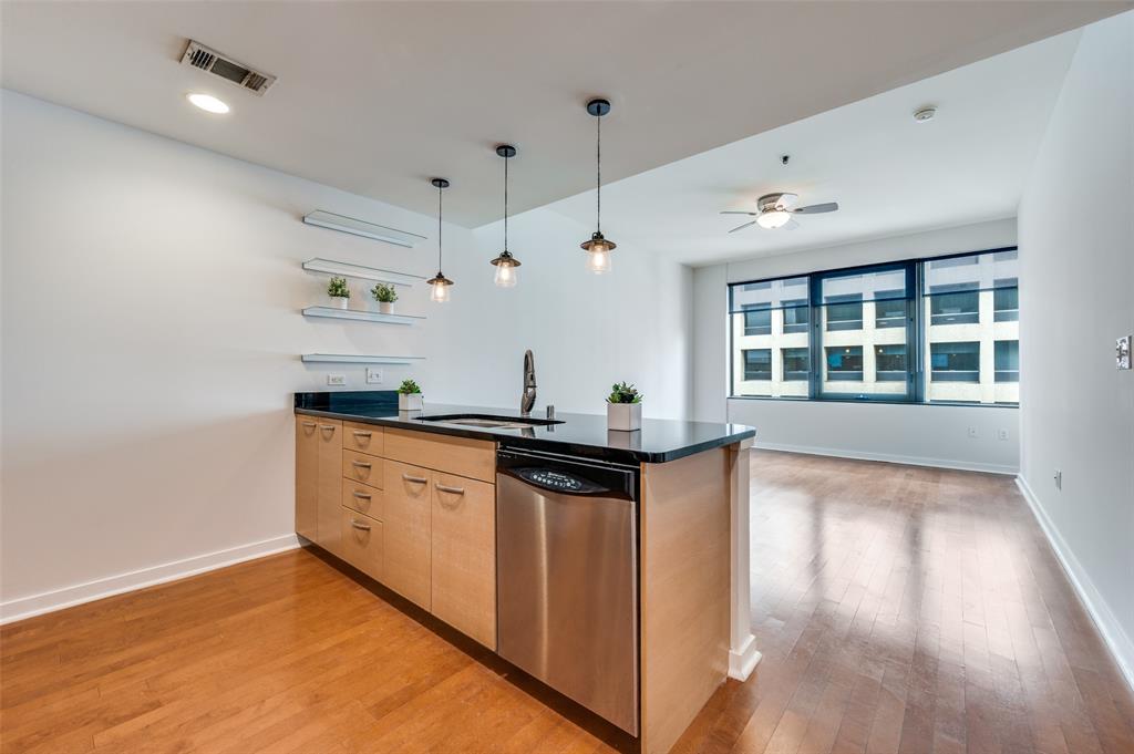 1200 Main Street, Unit 1908 Dallas, TX 75202 - Photo 2 of 27 a kitchen with stainless steel appliances granite countertop a stove and a sink