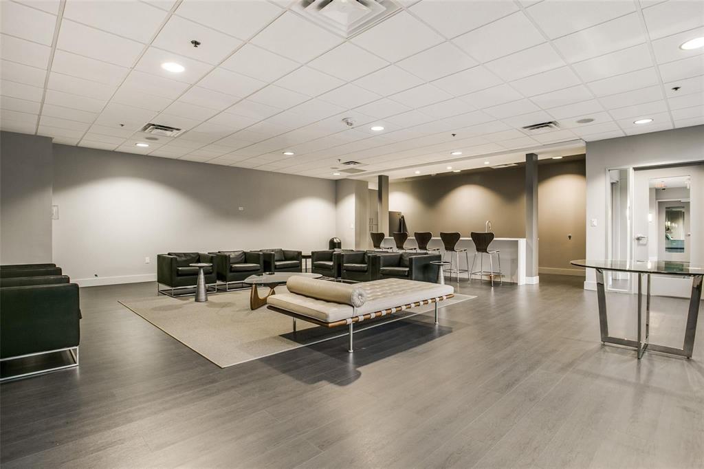 1200 Main Street, Unit 1908 Dallas, TX 75202 - Photo 22 of 27 a living room with furniture and wooden floor
