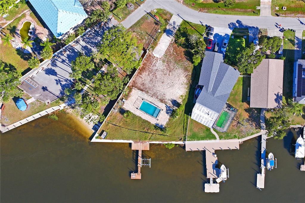 5224 Miller Bayou Drive Port Richey, FL 34668 - Photo 14 of 24 an aerial view of a house with a yard and garden