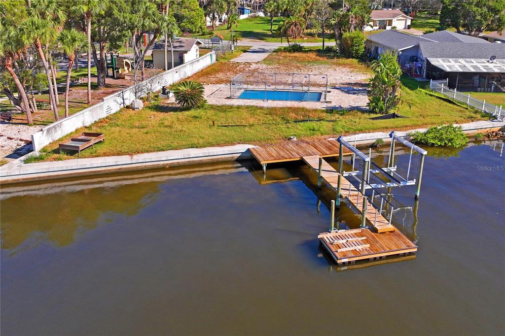 5224 Miller Bayou Drive Port Richey, FL 34668 - Photo 5 of 24 a view of a swimming pool with an outdoor space and seating area