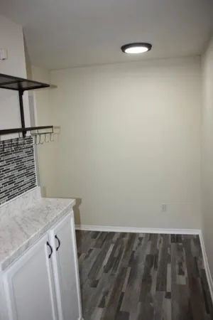 a bathroom with a sink and mirror