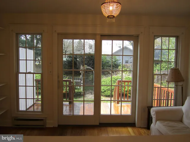 a view of staircase with white walls and railing