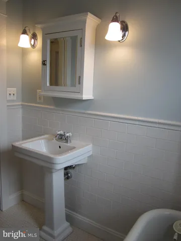 an empty room with wooden floor and closet