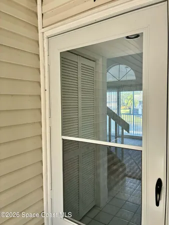 an aerial view of a house with a lake view