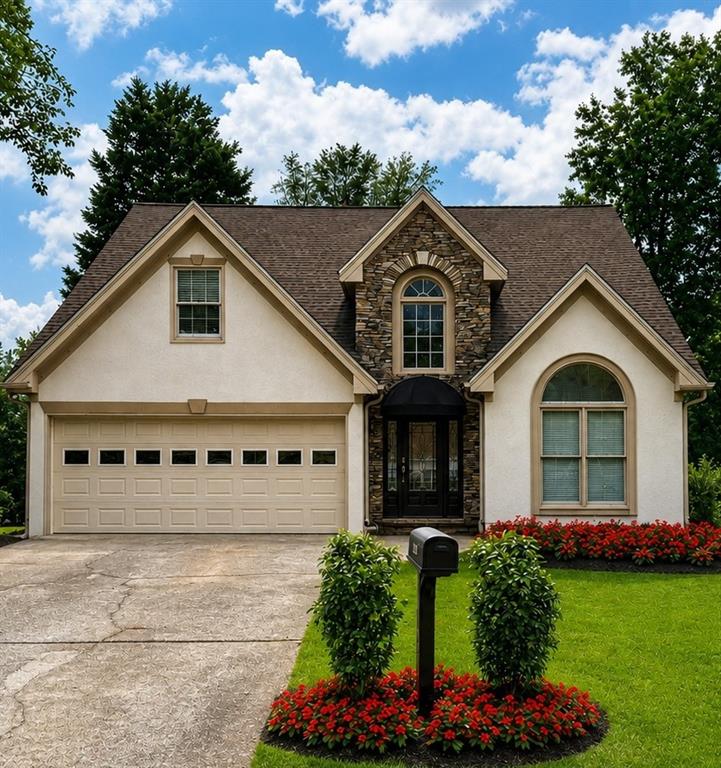 a front view of a house with a yard