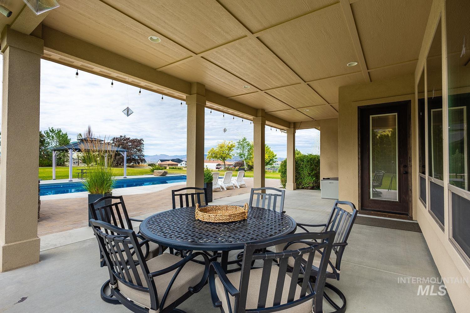 8077 Star Pass Ridge Road Nampa, ID 83686 - Photo 35 of 37 Covered patio with recessed lighting, offering an expansive outdoor living area