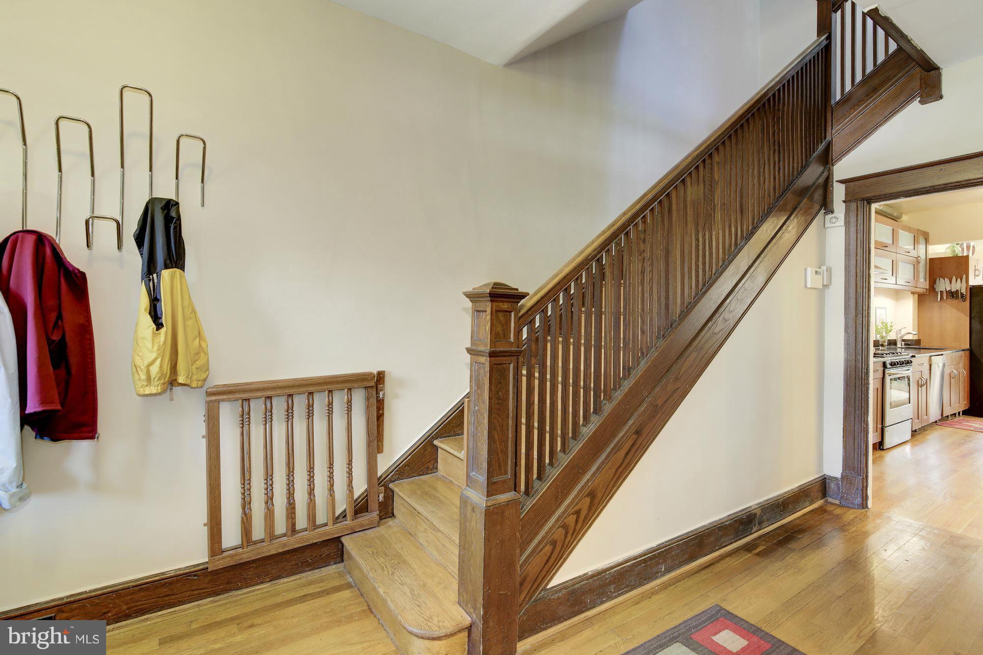 730 Rittenhouse Street Northwest Washington, DC 20011 - Photo 9 of 30 a view of a hallway with stairs and wooden floor
