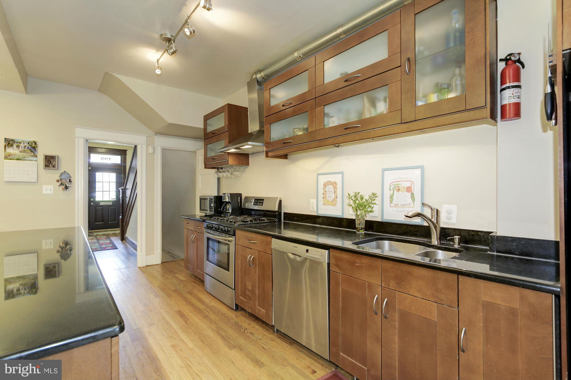 730 Rittenhouse Street Northwest Washington, DC 20011 - Photo 10 of 30 a kitchen with stainless steel appliances granite countertop a sink and stove