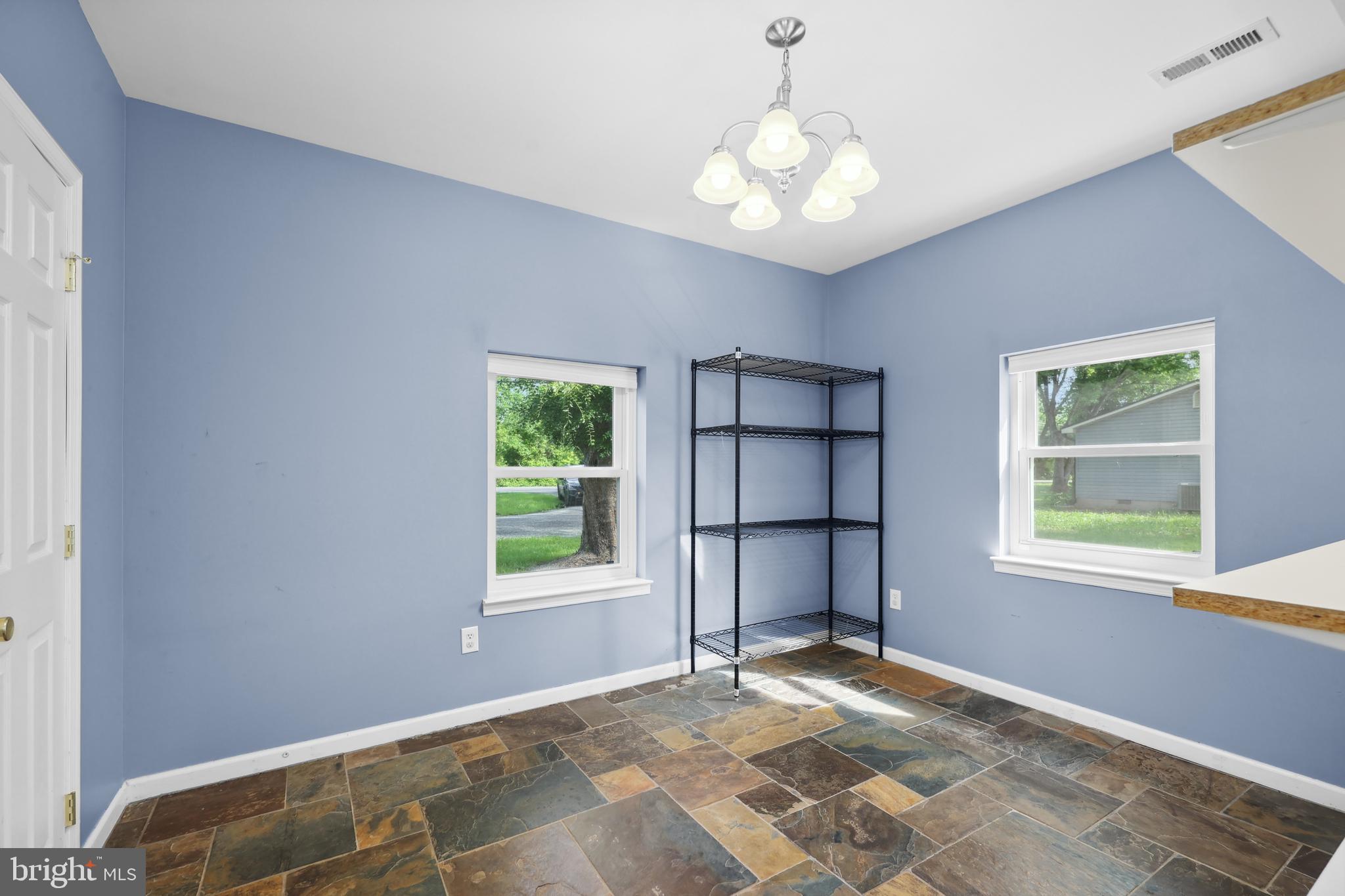 7103 Catlett Road Bealeton, VA 22712 - Photo 11 of 42 a view of a livingroom with a window and a chandelier