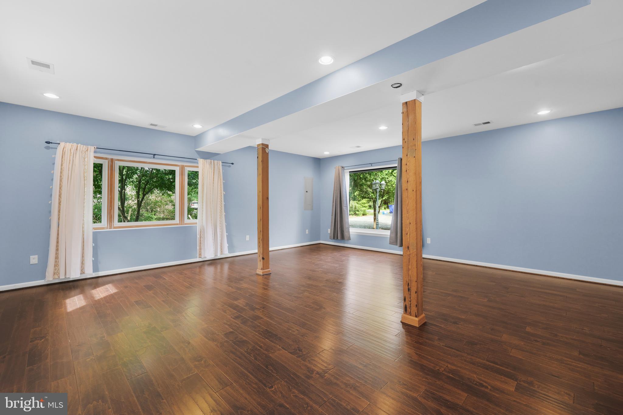7103 Catlett Road Bealeton, VA 22712 - Photo 16 of 42 a view of an empty room with wooden floor and a window