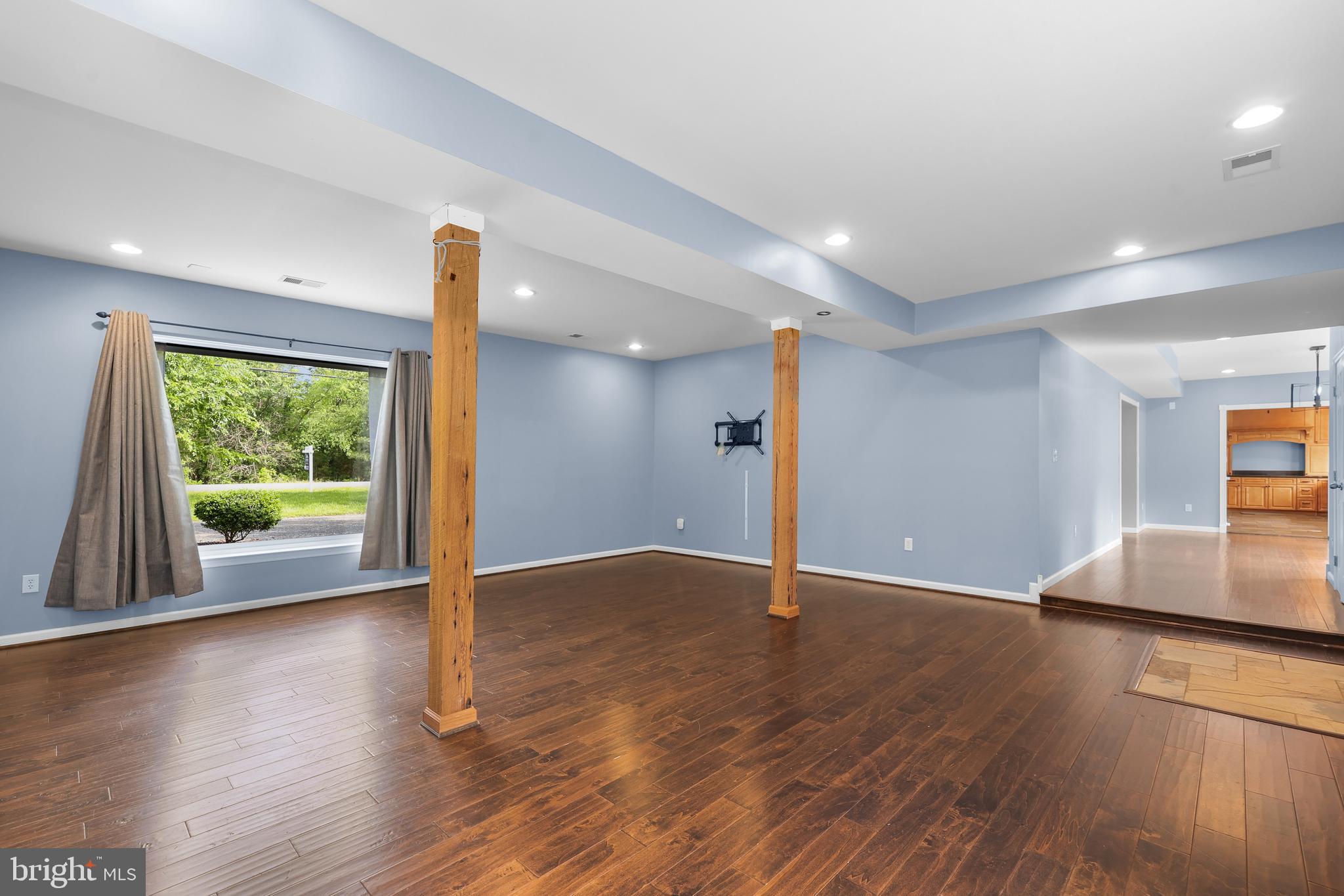 7103 Catlett Road Bealeton, VA 22712 - Photo 17 of 42 a view of an empty room with wooden floor and a window