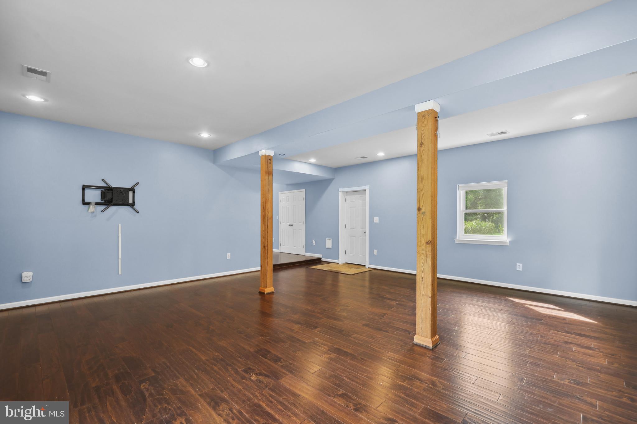 7103 Catlett Road Bealeton, VA 22712 - Photo 18 of 42 a view of an empty room with wooden floor
