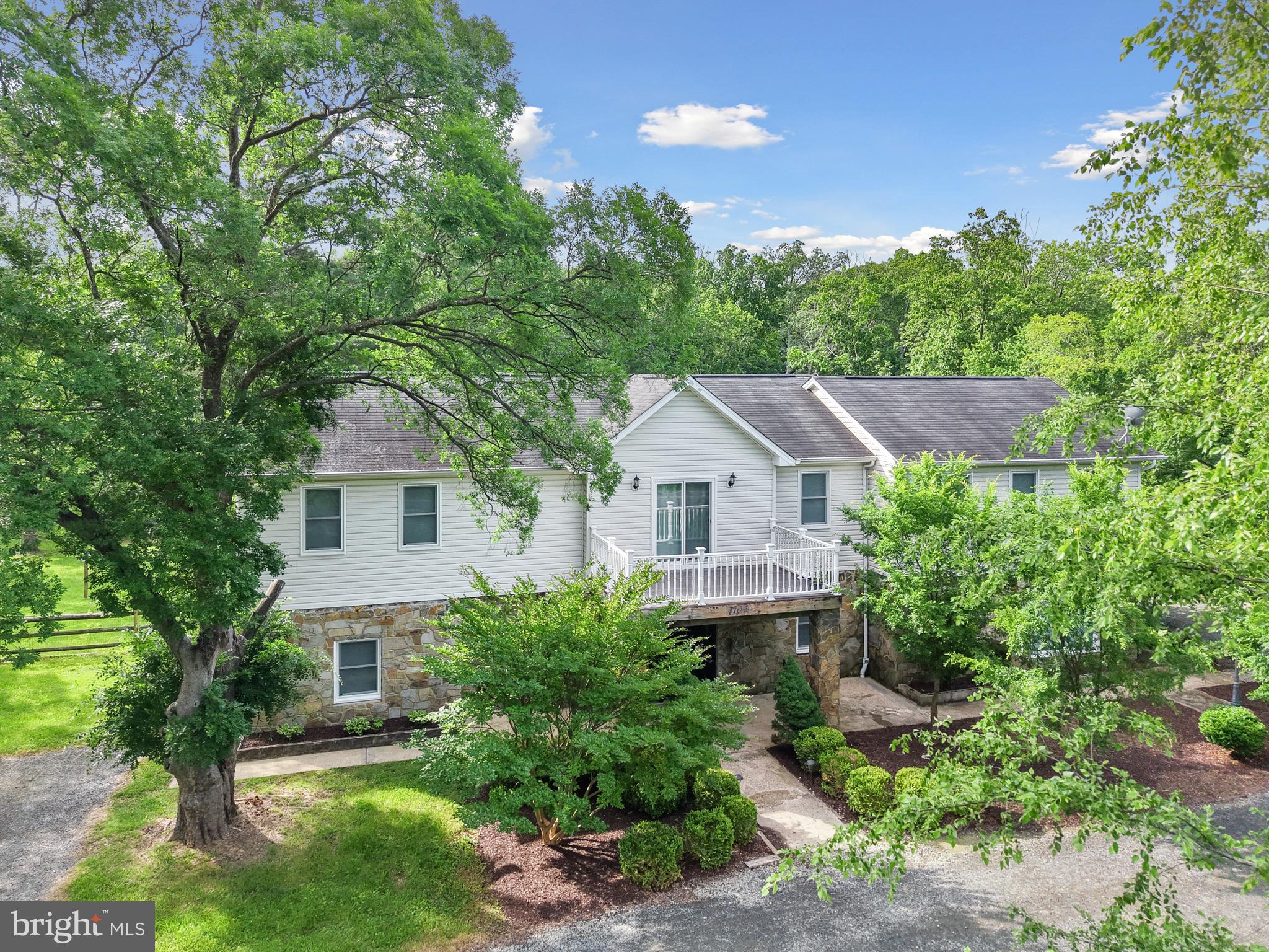 7103 Catlett Road Bealeton, VA 22712 - Photo 2 of 42 a front view of a house with a yard