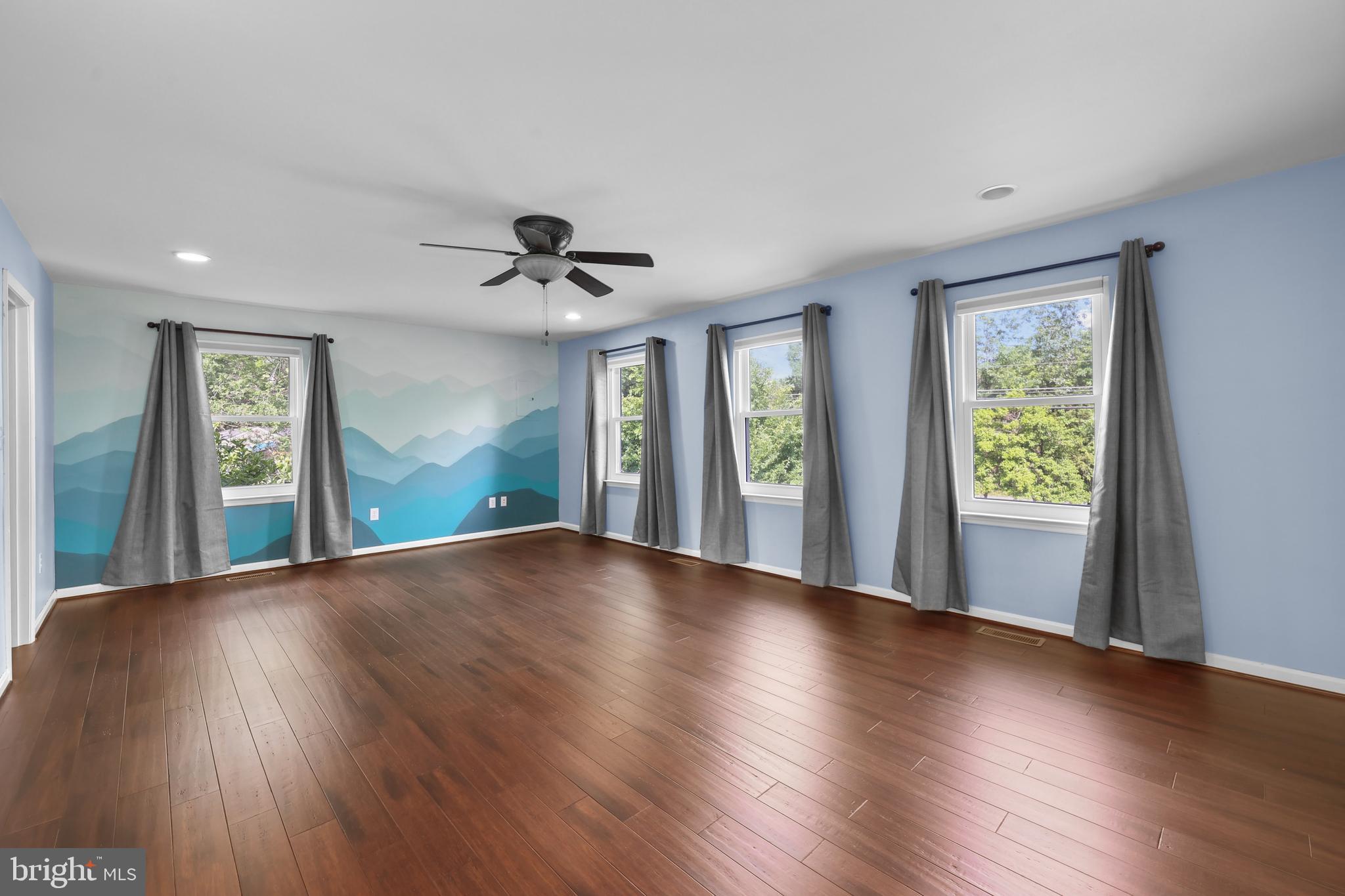 7103 Catlett Road Bealeton, VA 22712 - Photo 21 of 42 a view of an empty room with wooden floor and a window