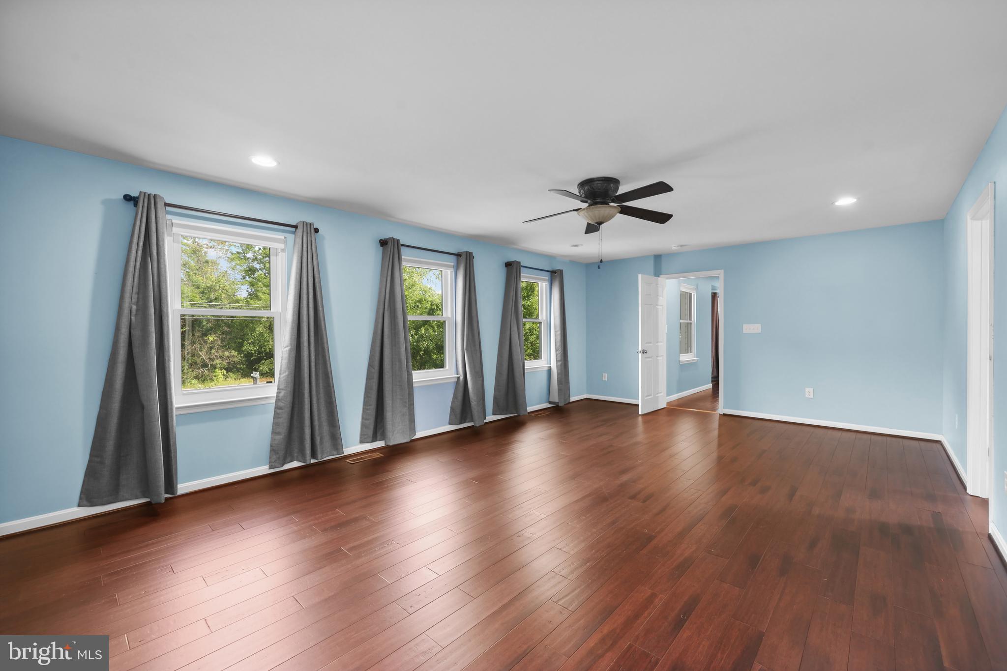 7103 Catlett Road Bealeton, VA 22712 - Photo 23 of 42 a view of an empty room with a window and wooden floor
