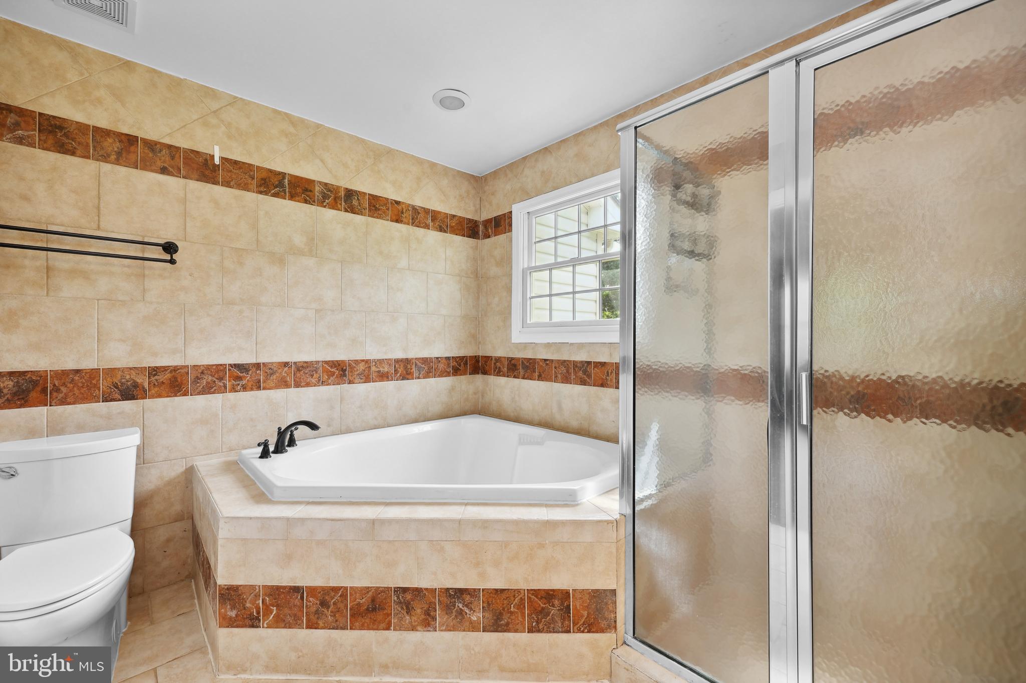 7103 Catlett Road Bealeton, VA 22712 - Photo 26 of 42 a bathroom with a tub and shower