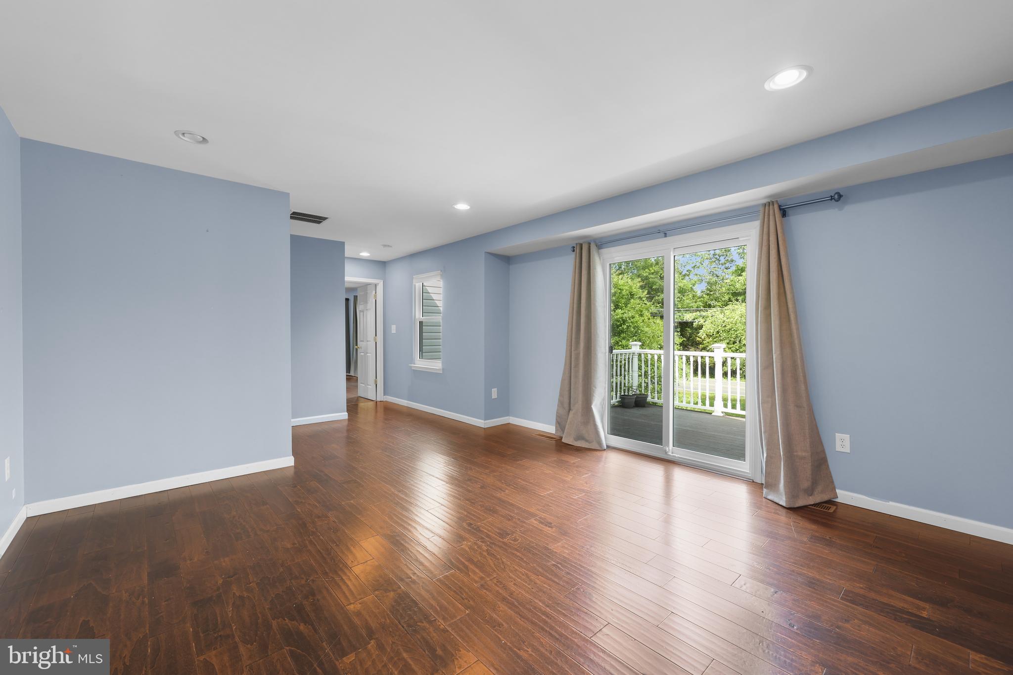 7103 Catlett Road Bealeton, VA 22712 - Photo 27 of 42 a view of empty room with wooden floor and fan