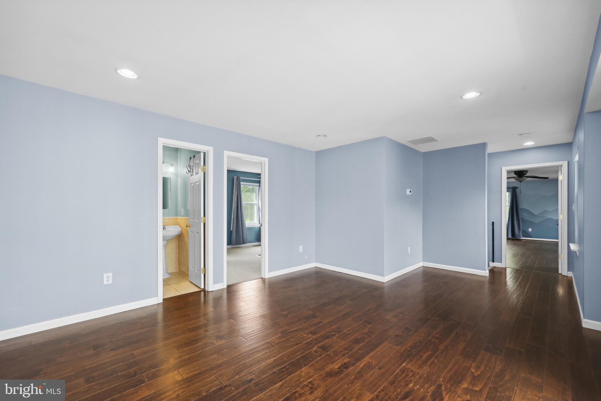 7103 Catlett Road Bealeton, VA 22712 - Photo 28 of 42 a view of an empty room with wooden floor and a window
