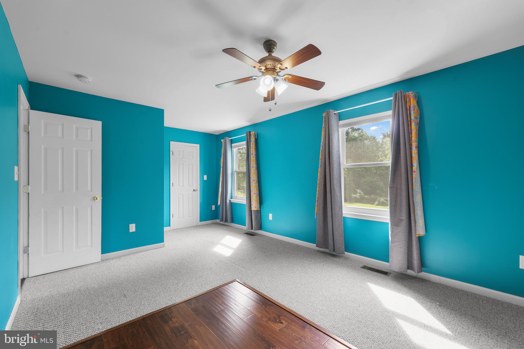 7103 Catlett Road Bealeton, VA 22712 - Photo 29 of 42 a view of a livingroom with a ceiling fan and window