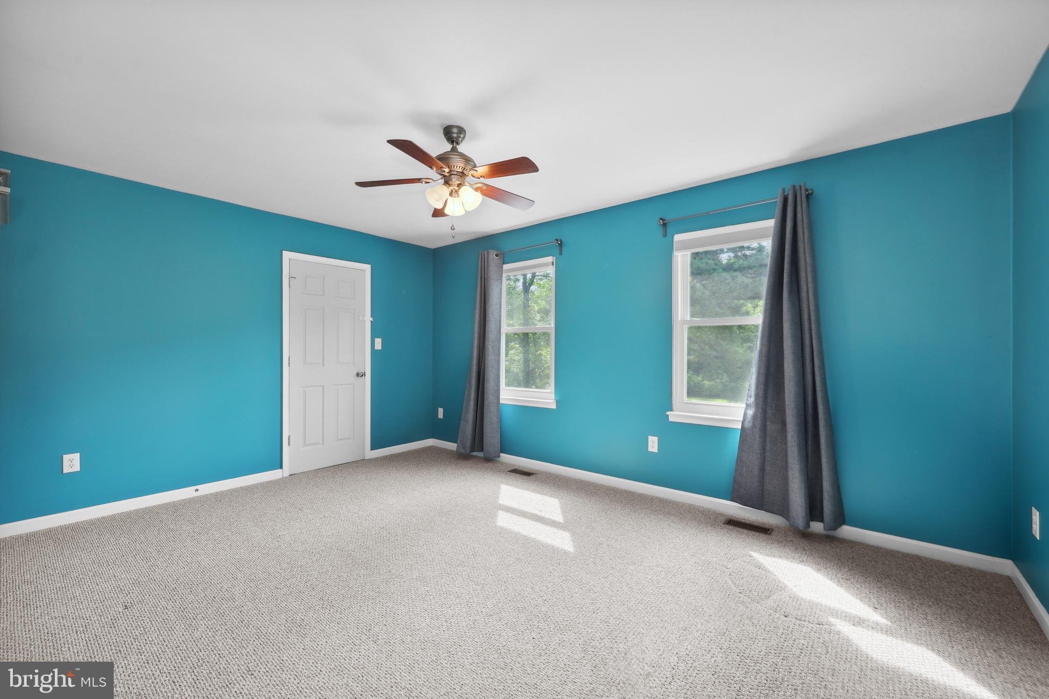 7103 Catlett Road Bealeton, VA 22712 - Photo 32 of 42 an empty room with windows and closet