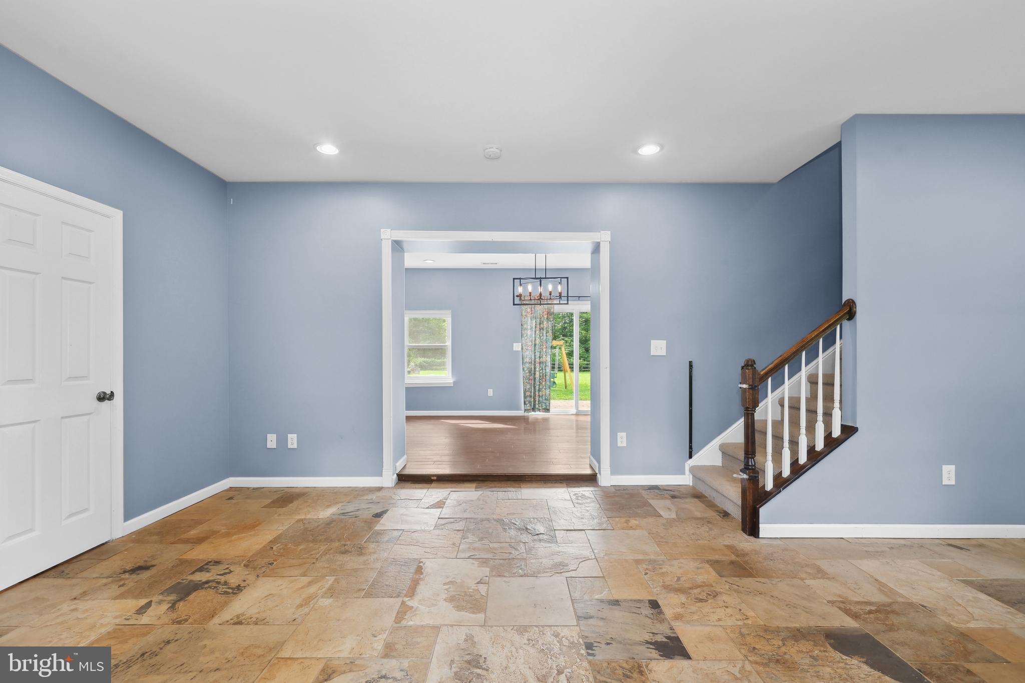 7103 Catlett Road Bealeton, VA 22712 - Photo 5 of 42 a view of an empty room with windows and stairs