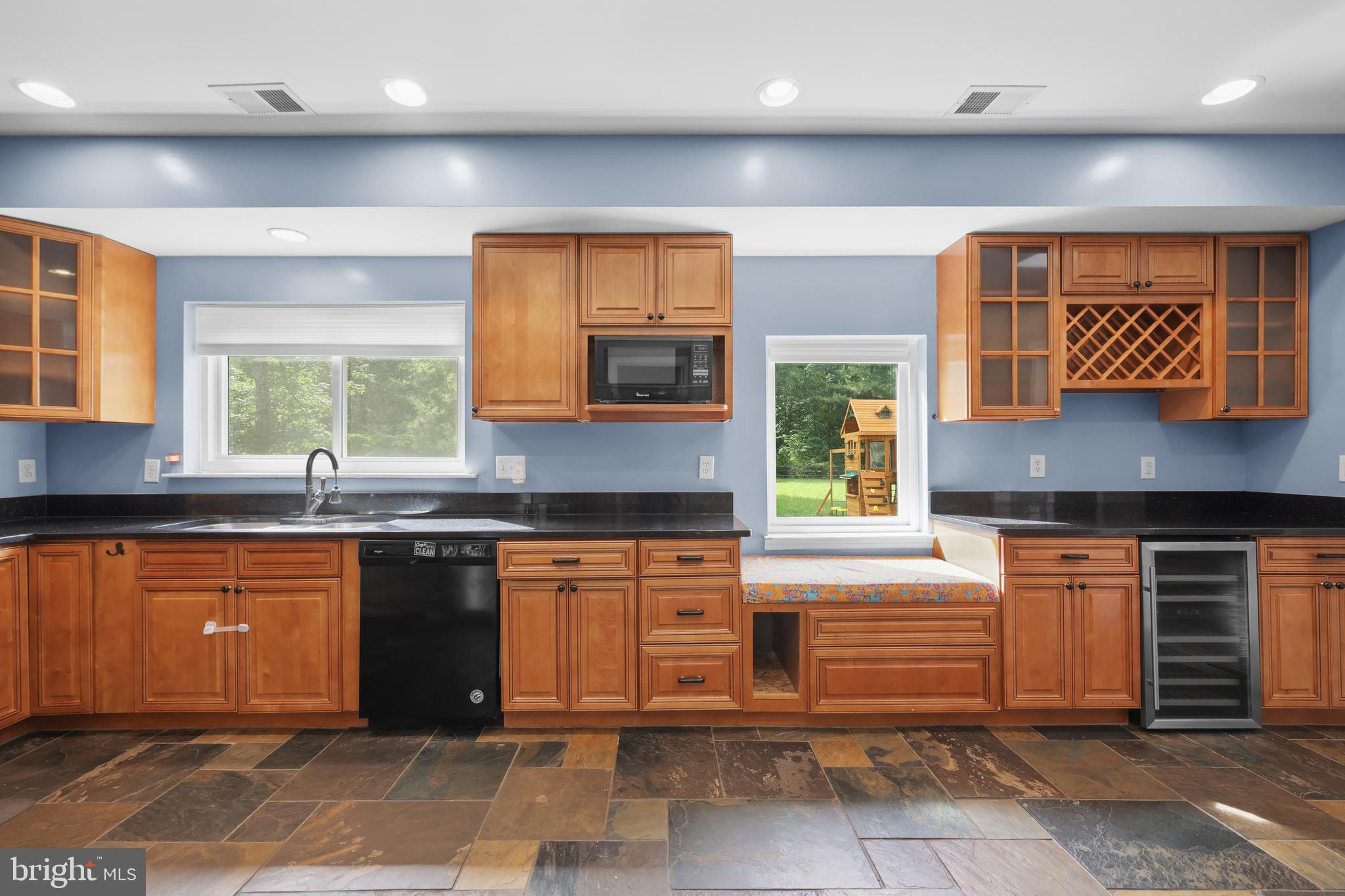 7103 Catlett Road Bealeton, VA 22712 - Photo 9 of 42 a kitchen with stainless steel appliances granite countertop a stove a sink and a microwave