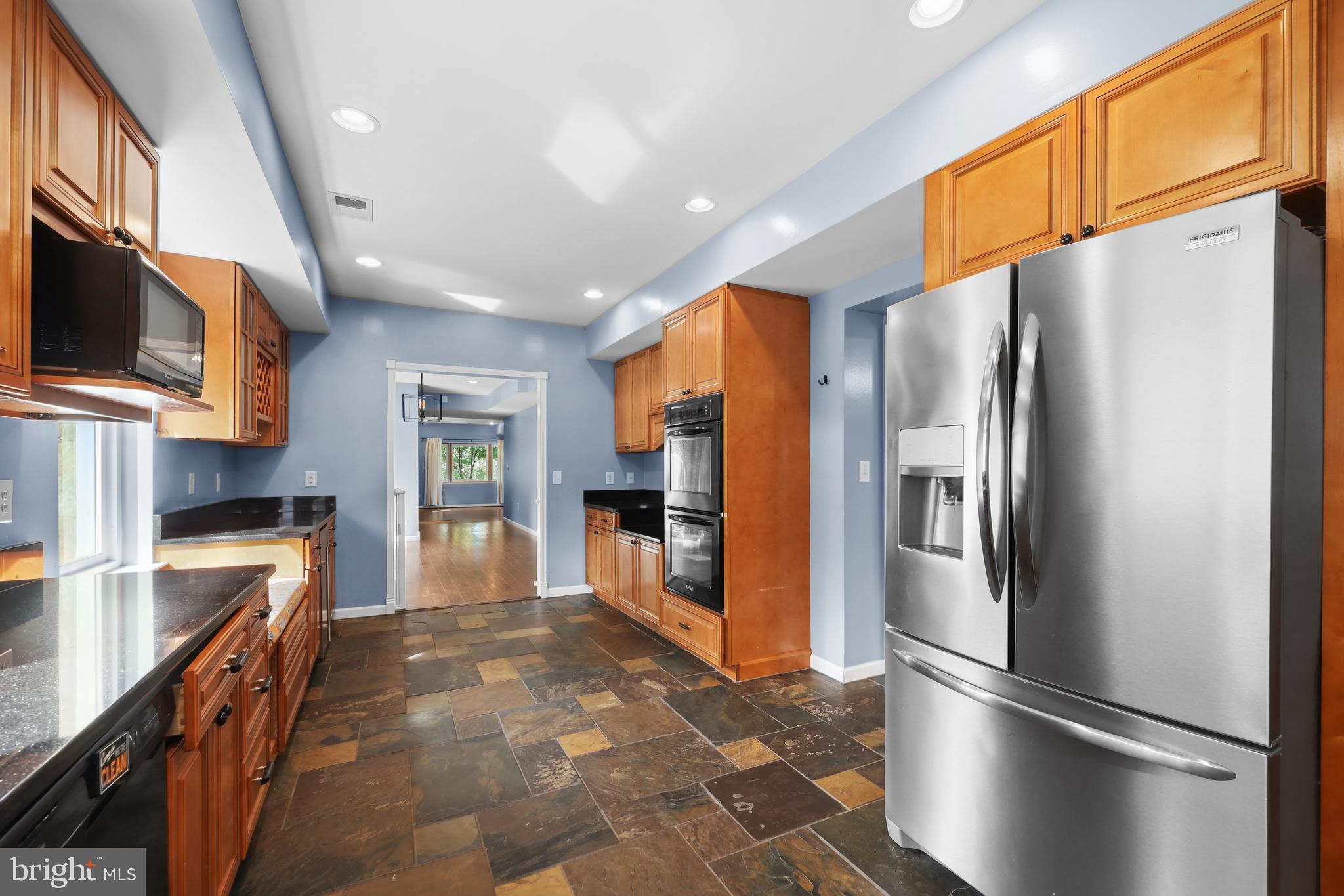 7103 Catlett Road Bealeton, VA 22712 - Photo 10 of 42 a kitchen with stainless steel appliances granite countertop a refrigerator a stove top oven a sink and dishwasher