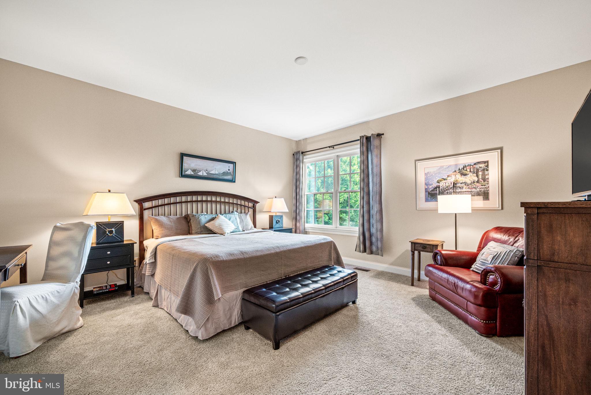 1548 Morstein Road Malvern, PA 19355 - Photo 48 of 80 a spacious bedroom with a bed couch and window