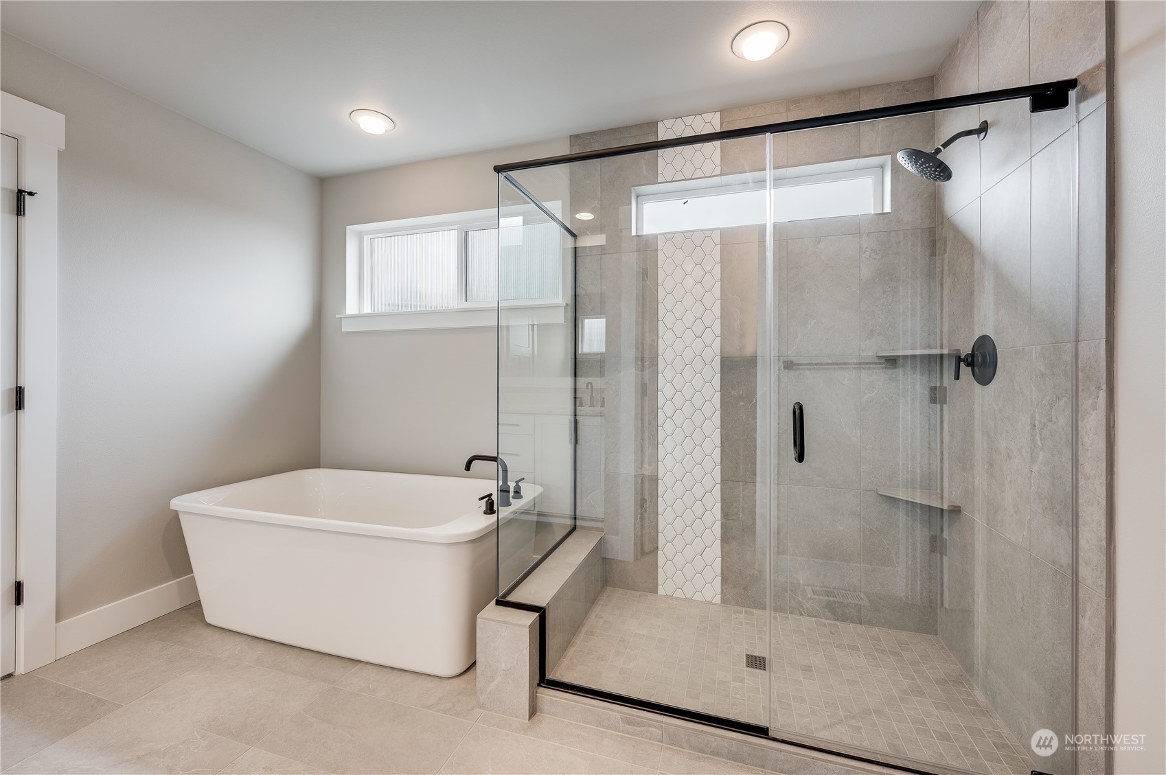 4403 242nd Place Southeast, Unit LOT16 Bothell, WA 98021 - Photo 20 of 27 a bathroom with a bathtub and a shower