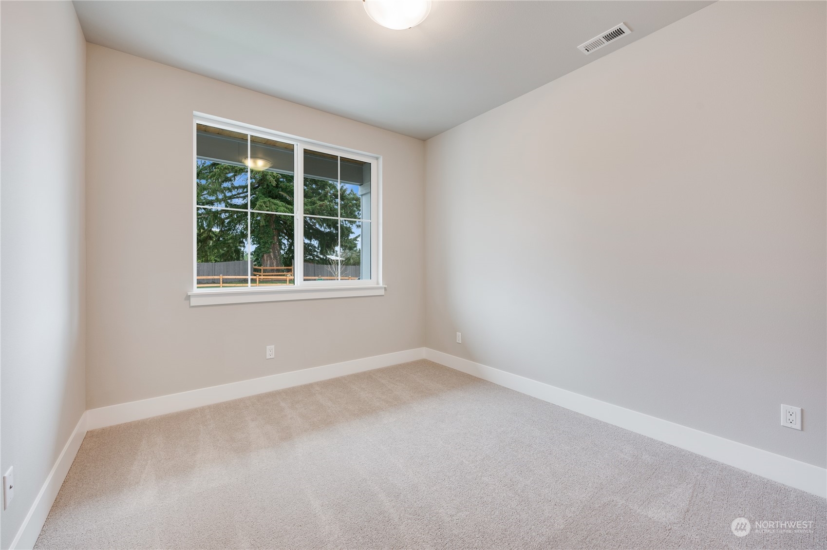 4403 242nd Place Southeast, Unit LOT16 Bothell, WA 98021 - Photo 6 of 27 an empty room with a window