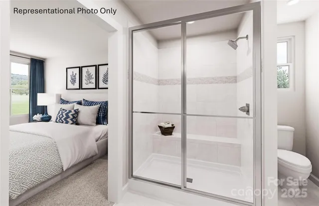 a bathroom with a glass shower door