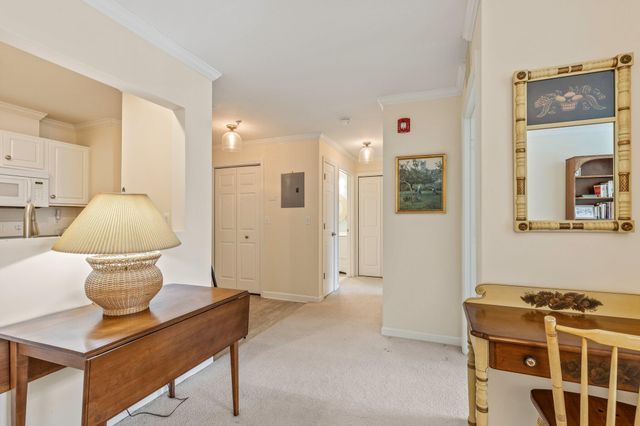 a living room with a sink and a mirror