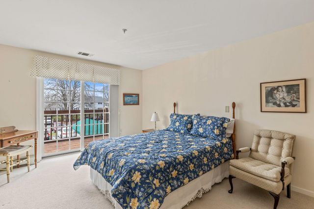 a bedroom with a large bed and a couch