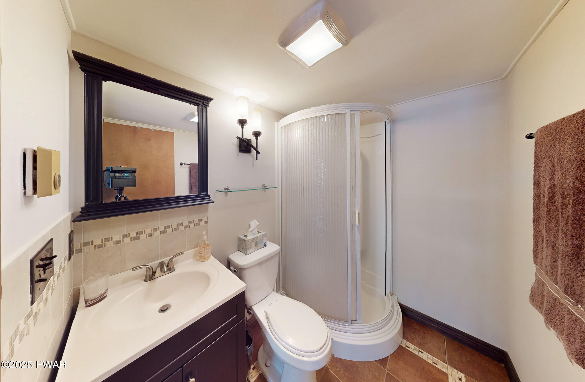 269 High Ridge Road Dingmans Ferry, PA 18328 - Photo 15 of 32 a bathroom with a sink a toilet and shower