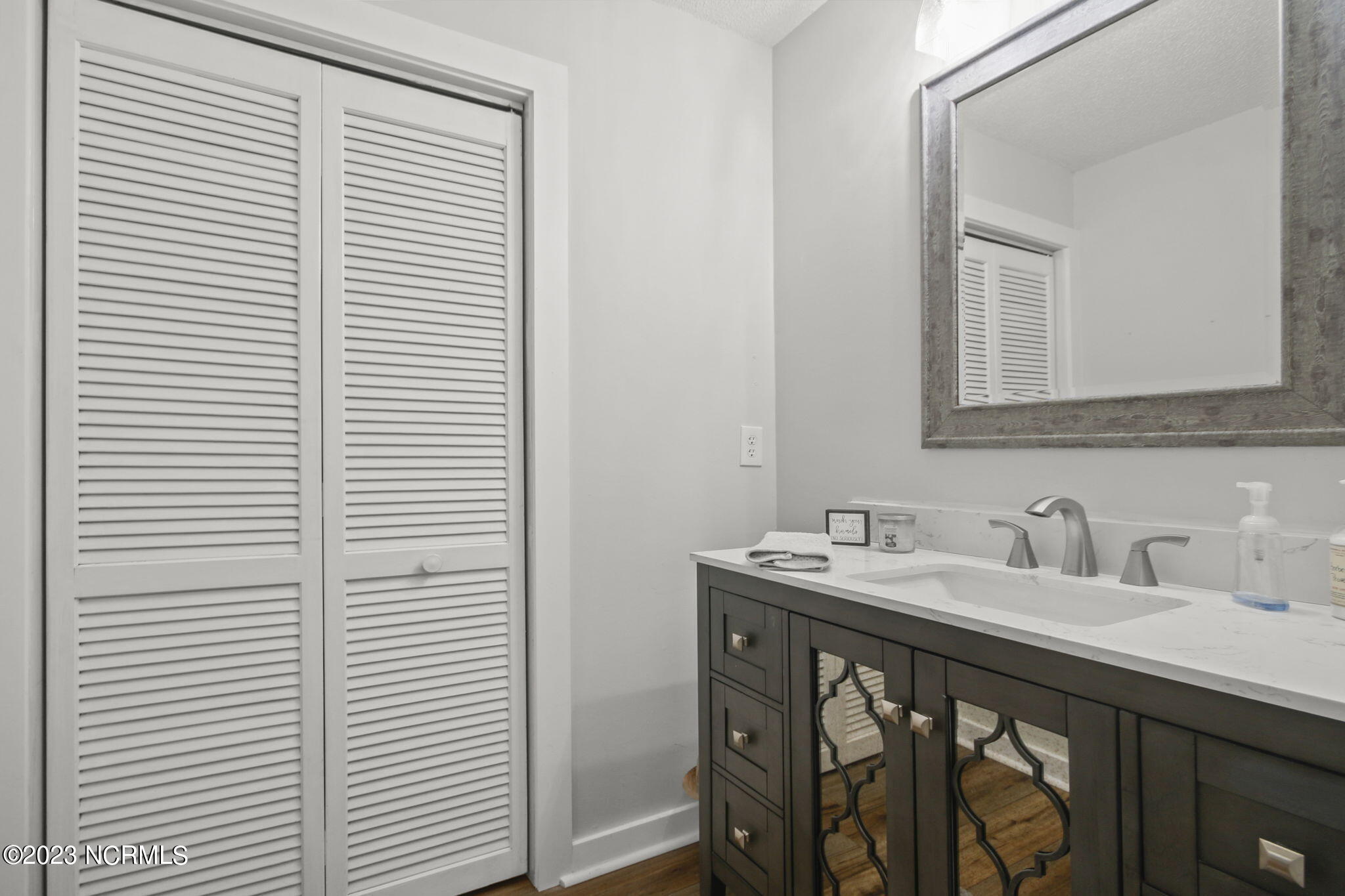 225 Clubhouse Road, Unit 706 Sunset Beach, NC 28468 - Photo 18 of 37 Vanity, Sink, Mirrow, light fixtures, toiles and countertop are new!