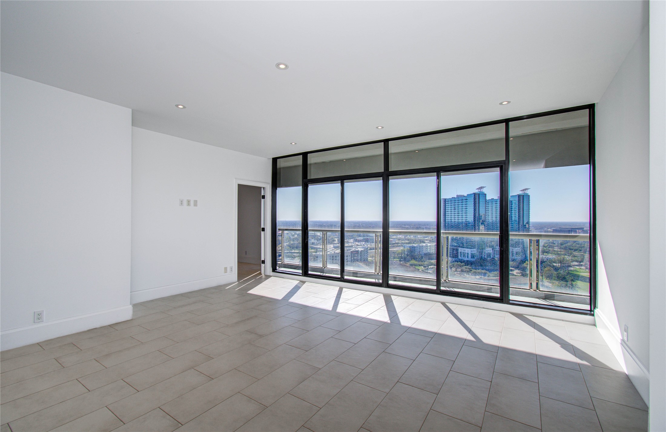 1701 Hermann Drive, Unit 20D Houston, TX 77004 - Photo 1 of 35 a view of an empty room with a window