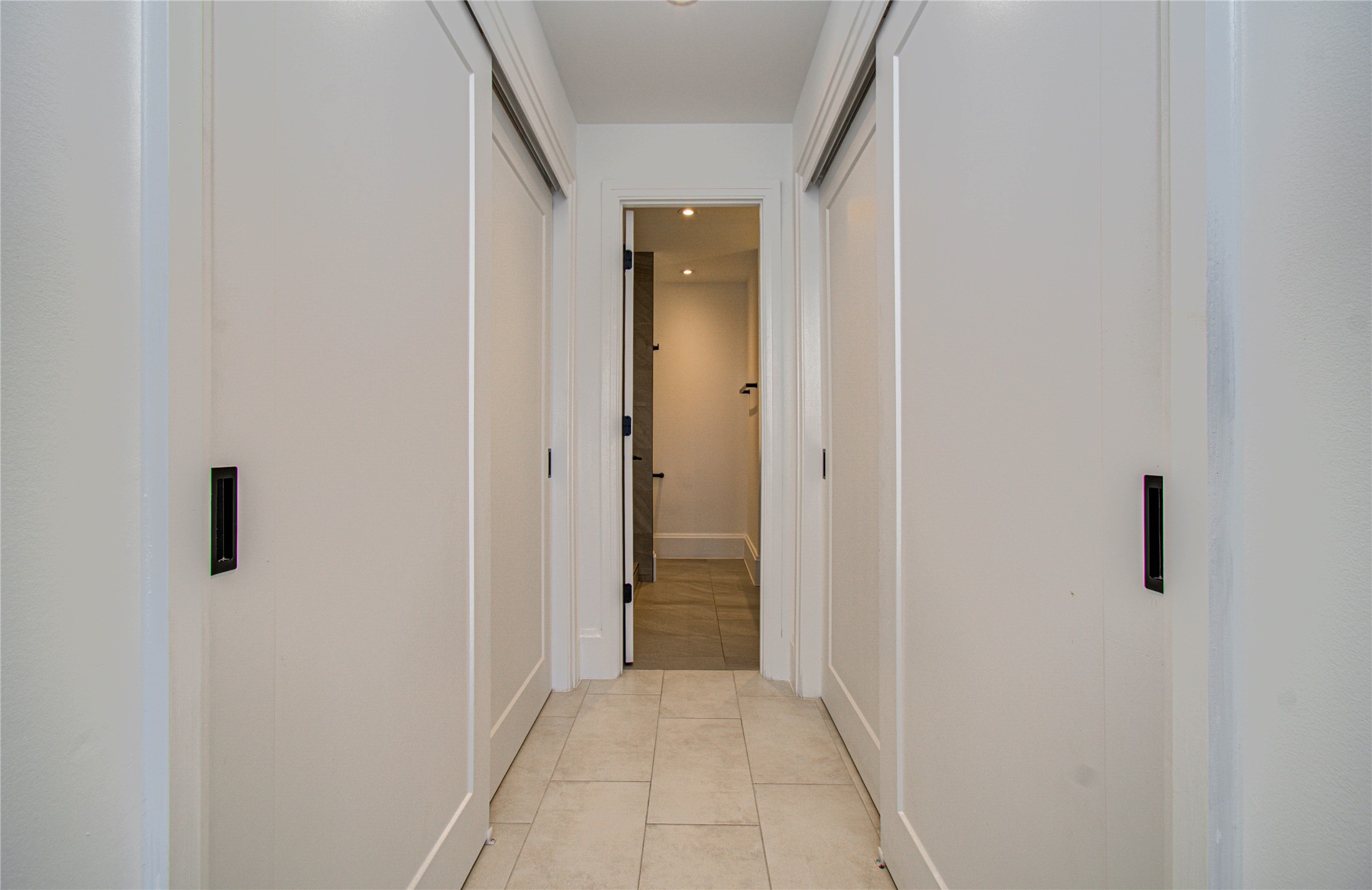 1701 Hermann Drive, Unit 20D Houston, TX 77004 - Photo 17 of 35 a view of a hallway with a wooden floor