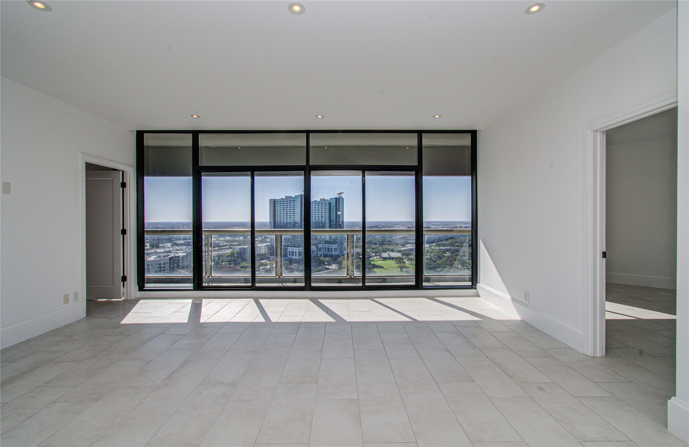 1701 Hermann Drive, Unit 20D Houston, TX 77004 - Photo 25 of 35 an empty room with large windows