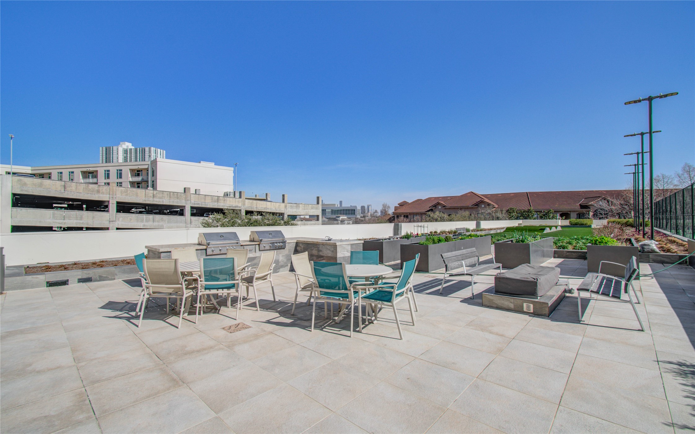 1701 Hermann Drive, Unit 20D Houston, TX 77004 - Photo 31 of 35 a view of a terrace with seating area and barbeque oven