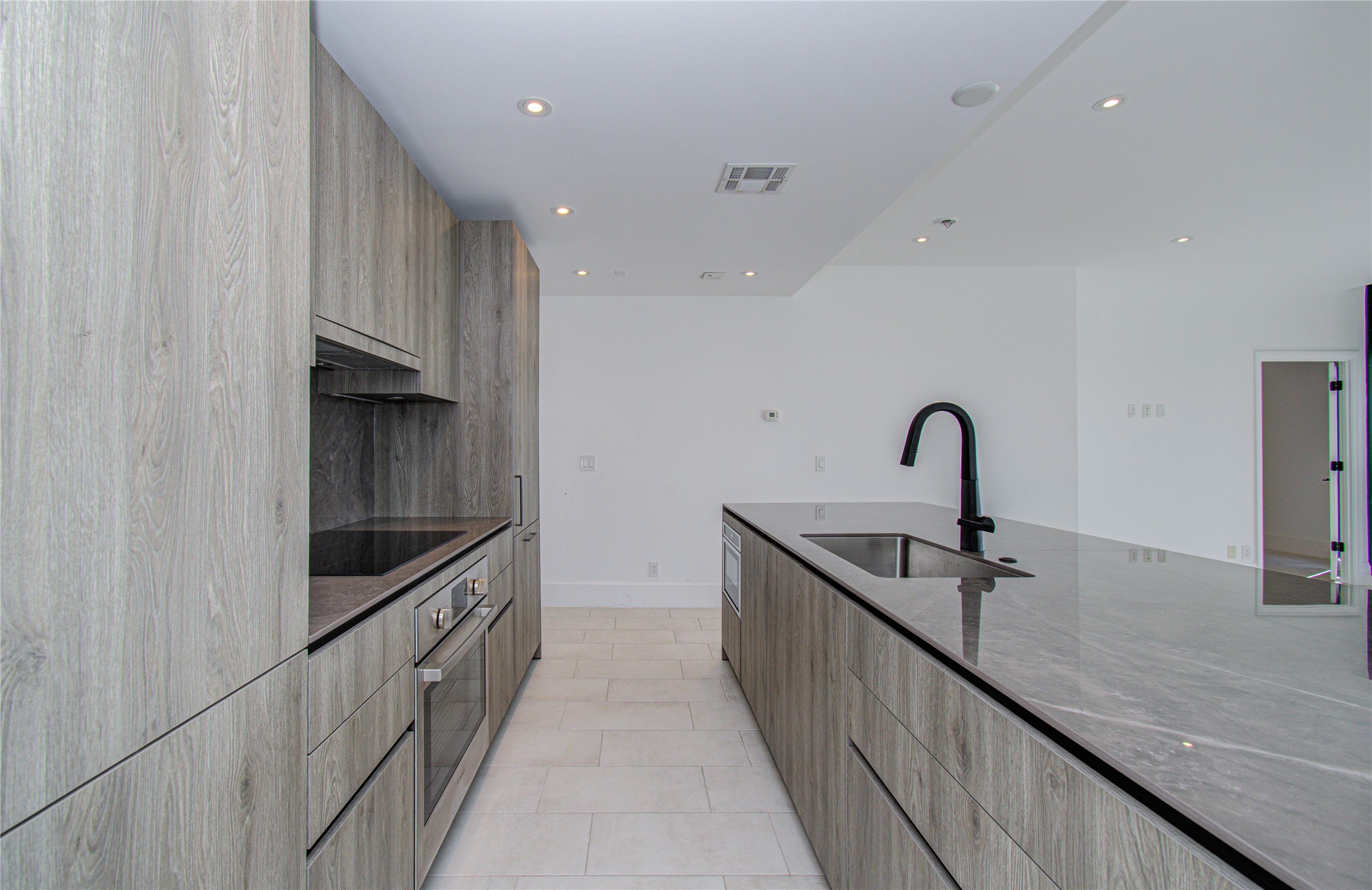 1701 Hermann Drive, Unit 20D Houston, TX 77004 - Photo 6 of 35 a kitchen with sink and faucet