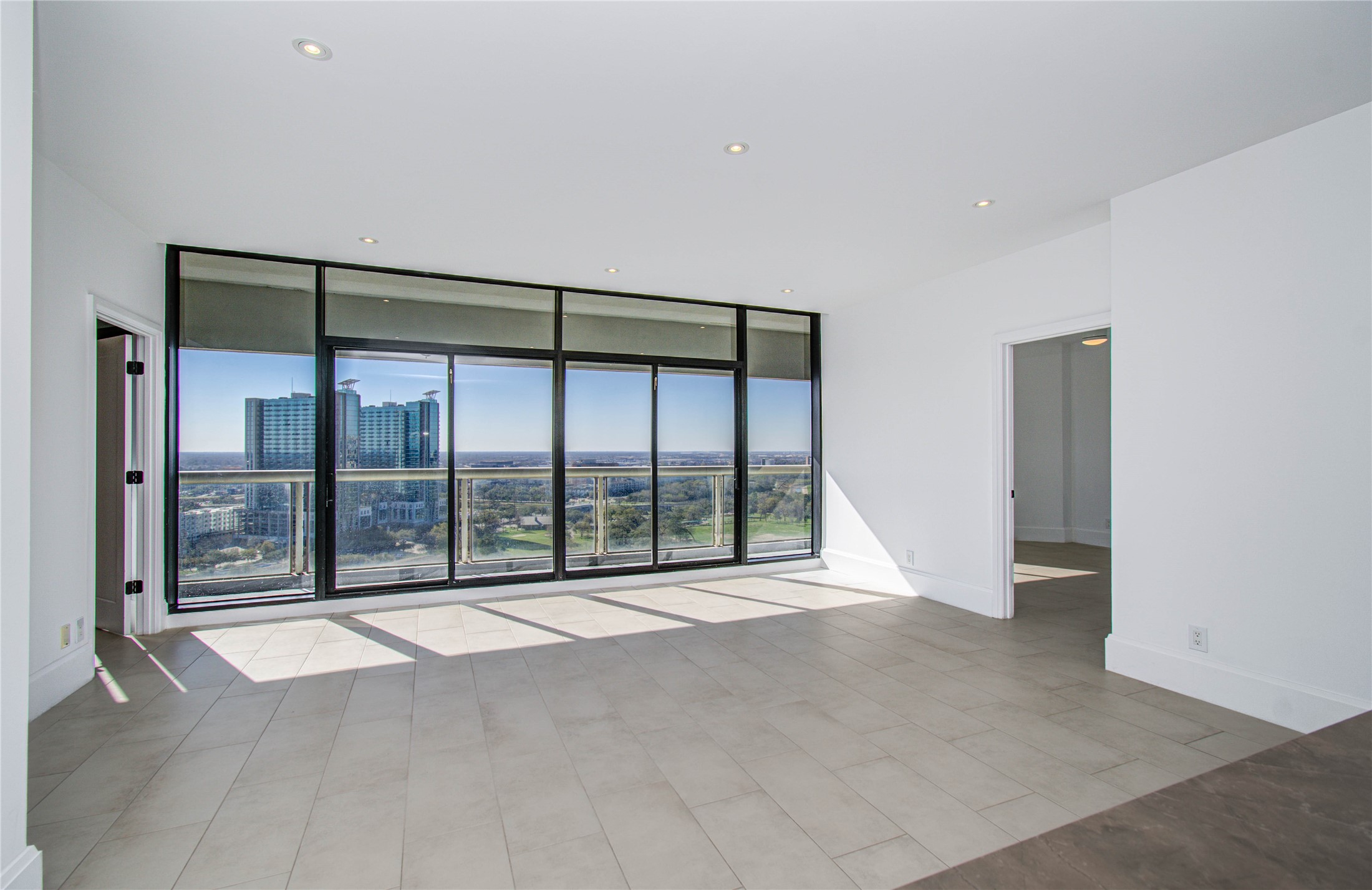 1701 Hermann Drive, Unit 20D Houston, TX 77004 - Photo 9 of 35 a view of an empty room with a balcony