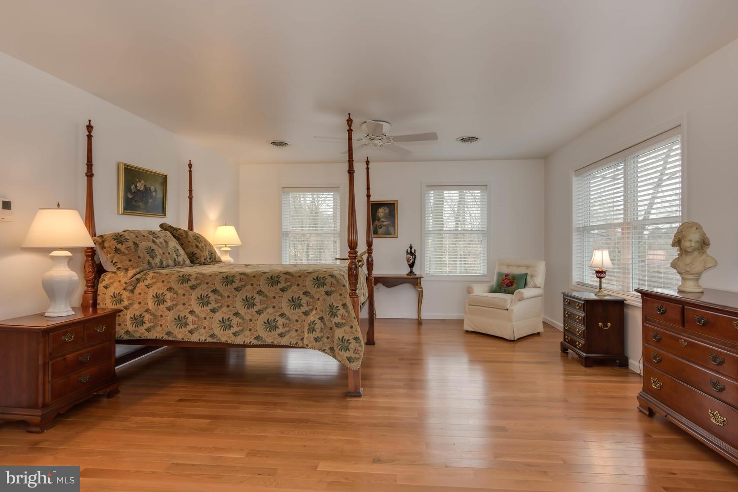 29030 Belchester Road Kennedyville, MD 21645 - Photo 19 of 30 a bed room with furniture and wooden floor