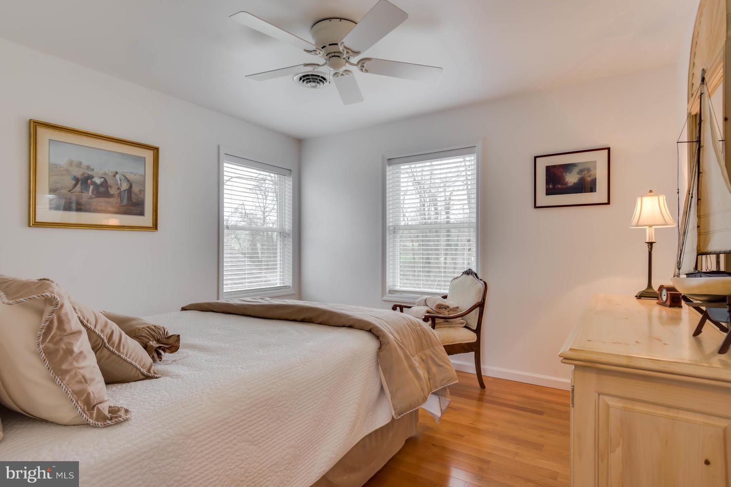 29030 Belchester Road Kennedyville, MD 21645 - Photo 25 of 30 a bedroom with a bed and a table