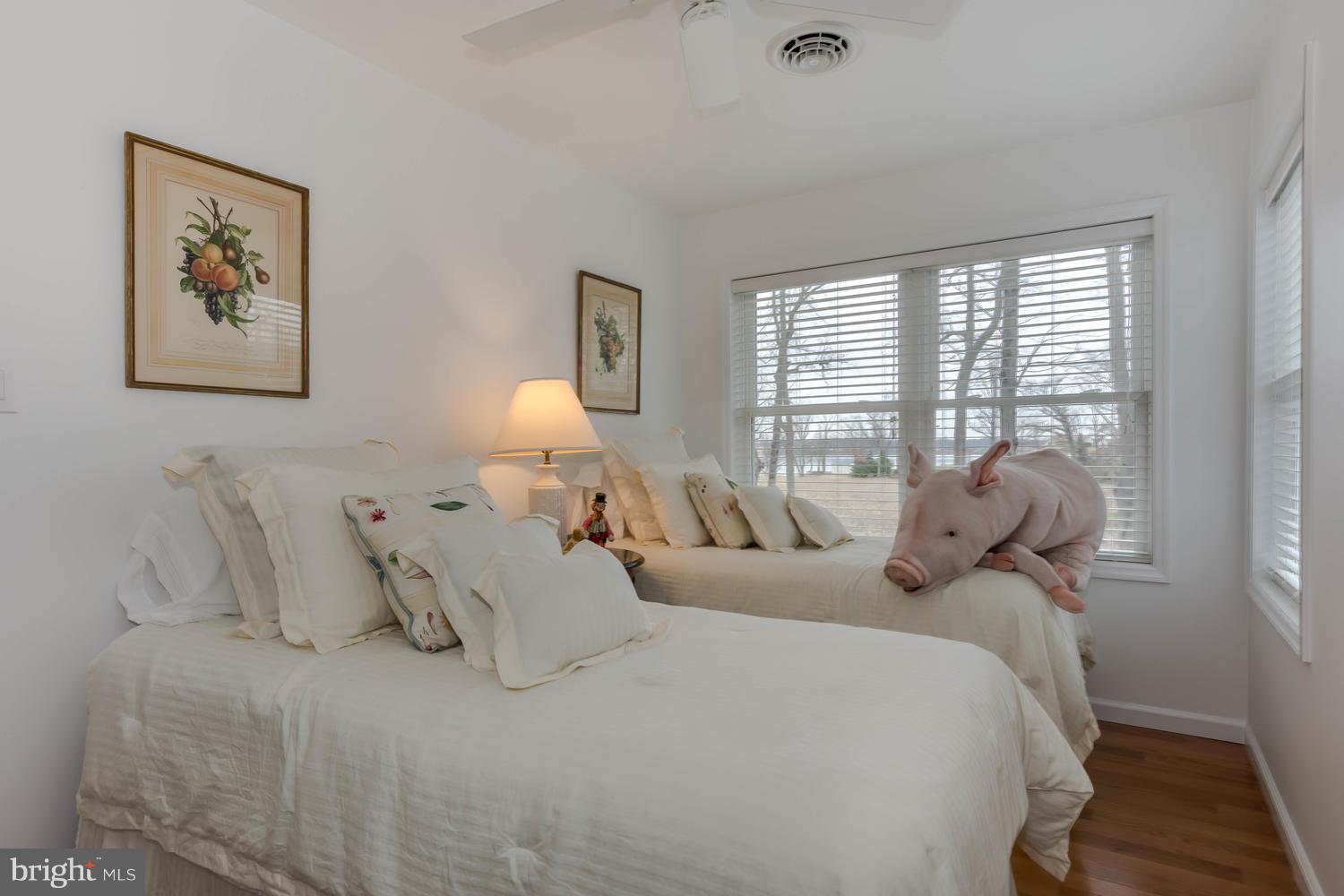 29030 Belchester Road Kennedyville, MD 21645 - Photo 26 of 30 a bedroom with bed and large window