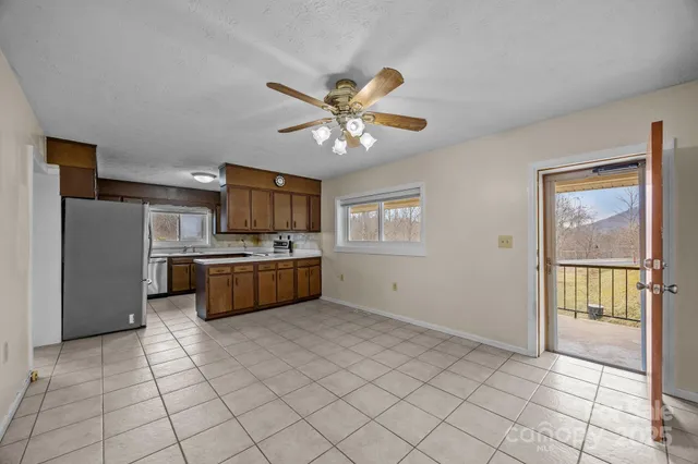 a kitchen with stainless steel appliances a sink and a refrigerator