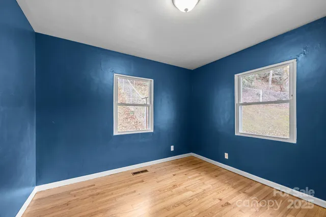 a view of empty room with windows