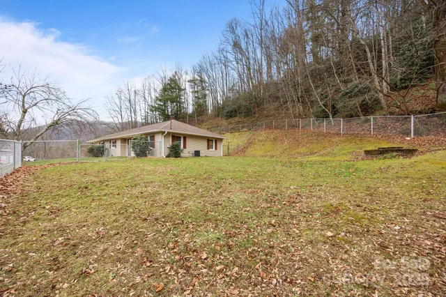 a house with swimming pool in front of it
