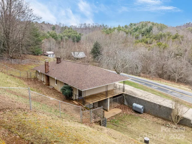 a view of a terrace with a yard and mountain view