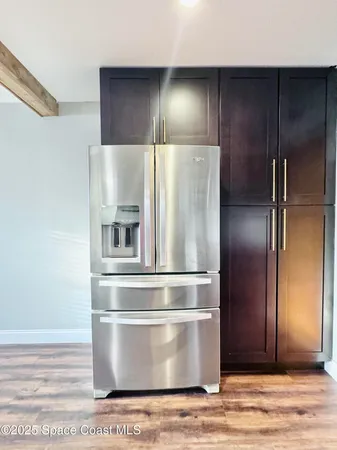 a refrigerator freezer sitting inside of a kitchen